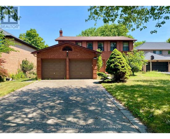 A brick house with a garage door in the front.