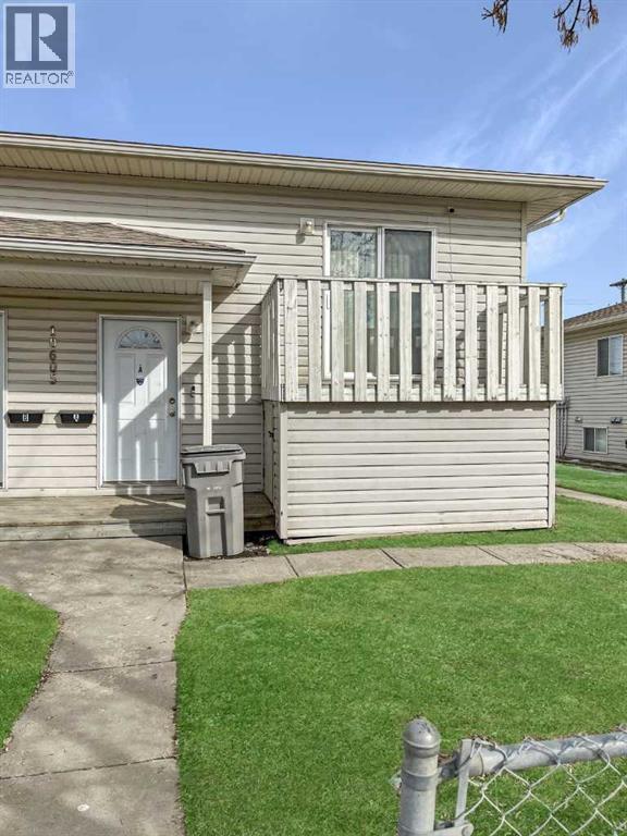 A house with a white door and a small porch.