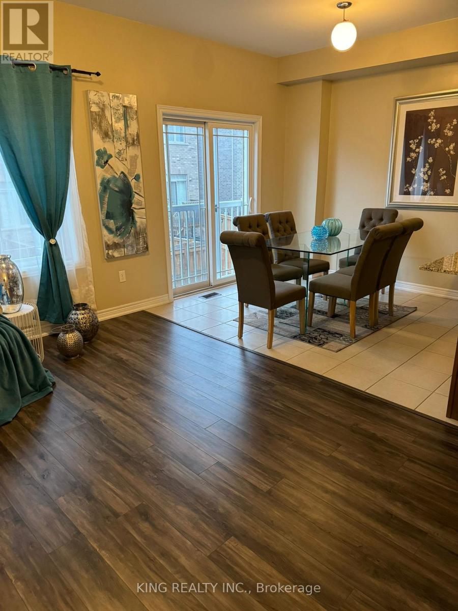 A dining room with a glass table and chairs.
