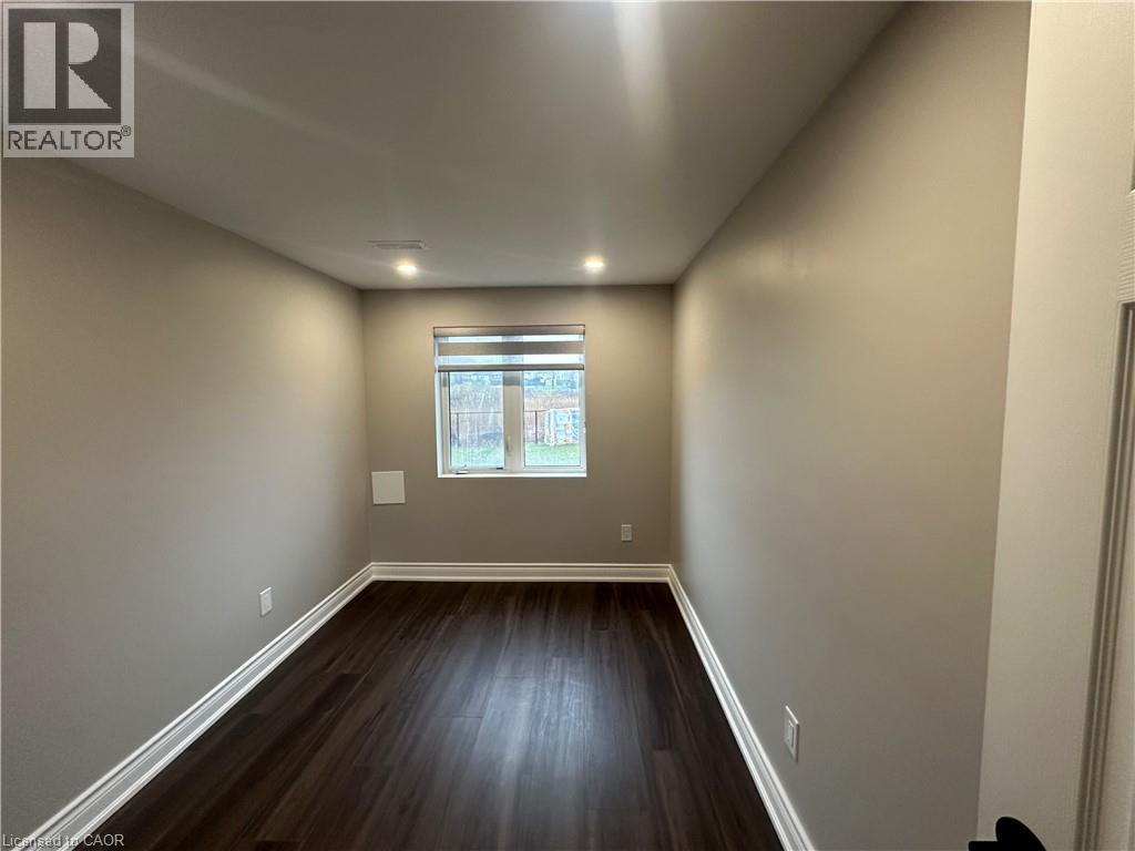 A room with wooden floors and a window.