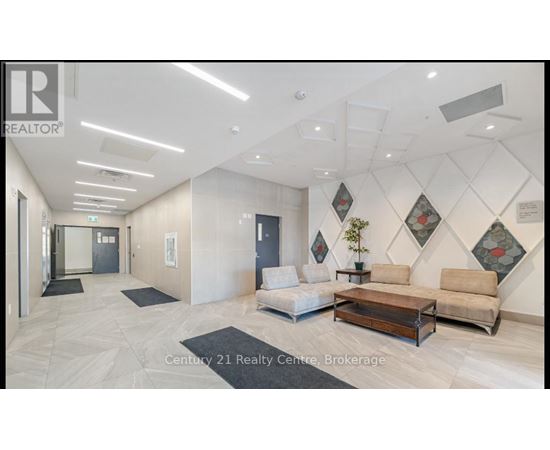A spacious living room with a sofa set and a coffee table.