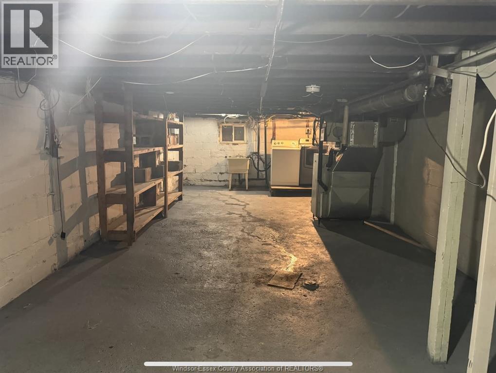 A large, empty warehouse space with a concrete floor and walls.