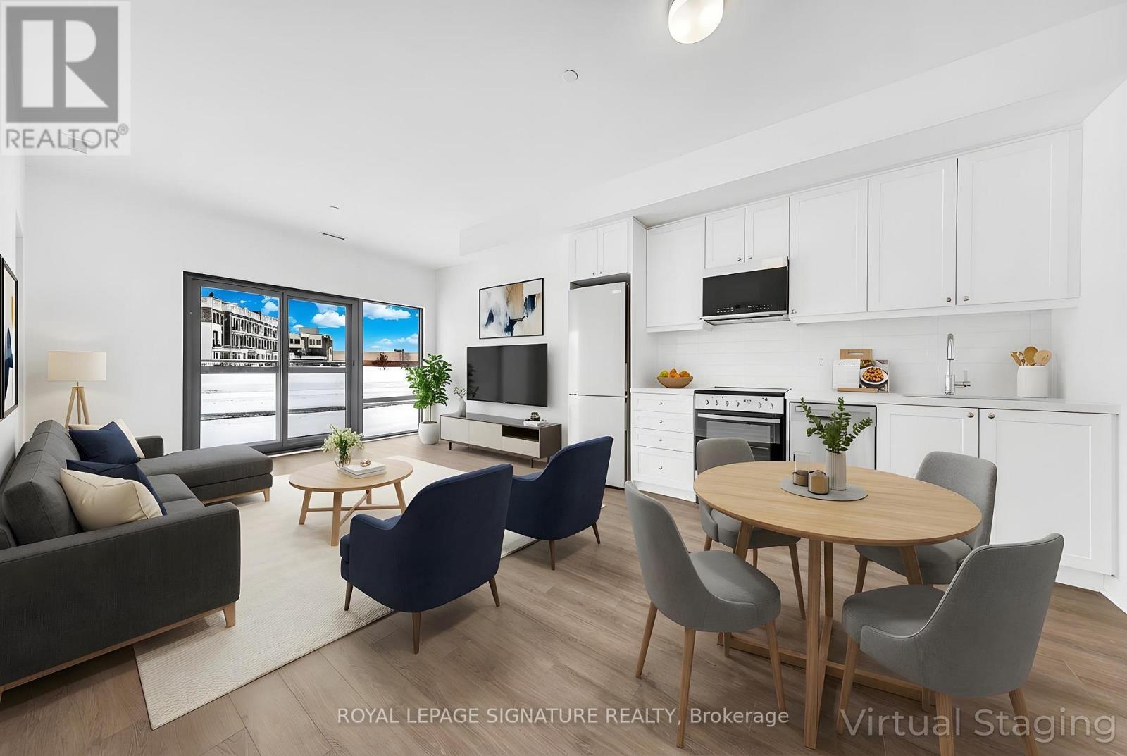 A modern living room with a dining area and kitchen in the background.