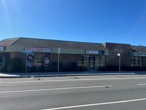 A street view of a building with the sign "Smith Vision 40" on it.