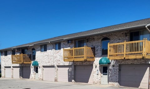 A building with a stone facade and wooden balconies.