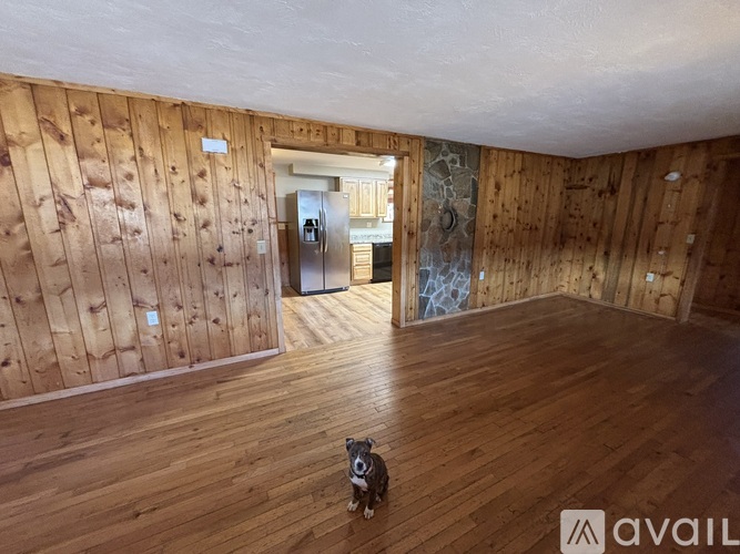 A living room with wooden floors and a couch.