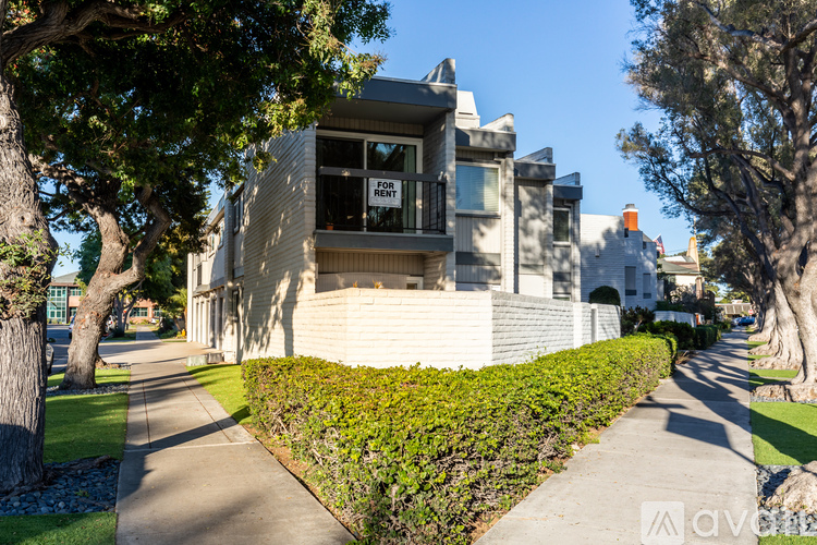 A house with a for sale sign in the window.