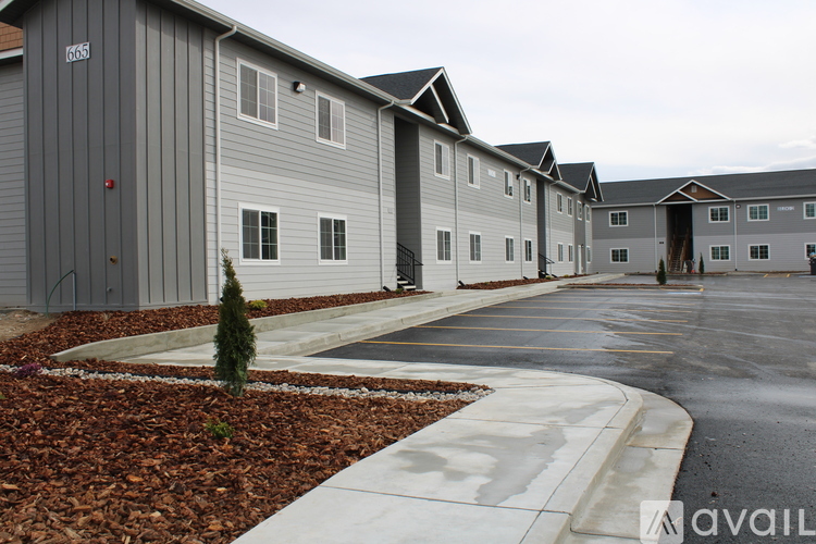 A row of houses with the number 666 on the first one.