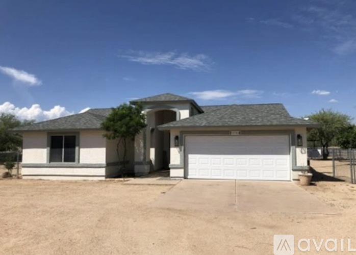 A house with a garage is available for sale.