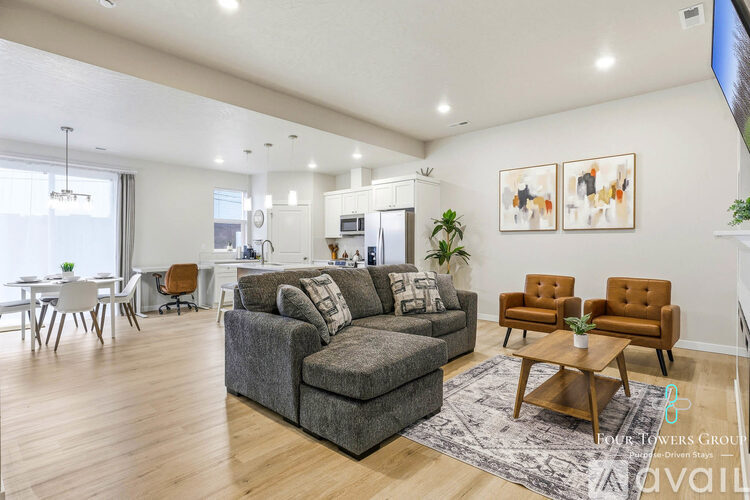 A living room with a grey couch and a coffee table.