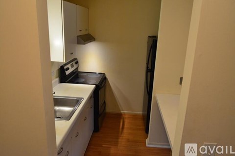 A small kitchen with a sink and stove.