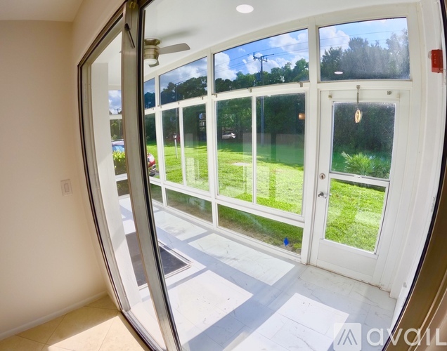 A white door with a glass window and a handle.