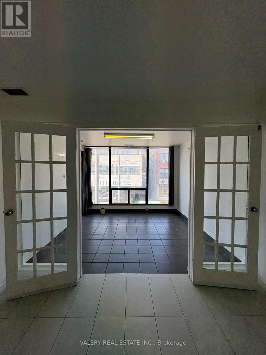 A hallway with a sign that says "REALTOR" on the wall.