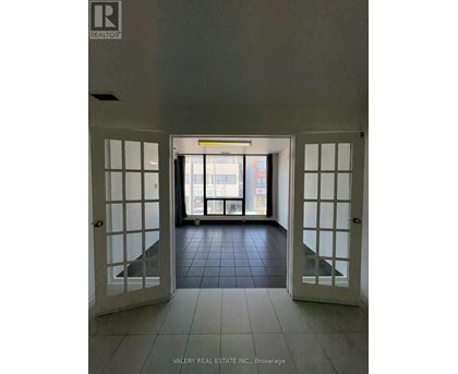 A hallway with a sign that says "REALTOR" on the wall.