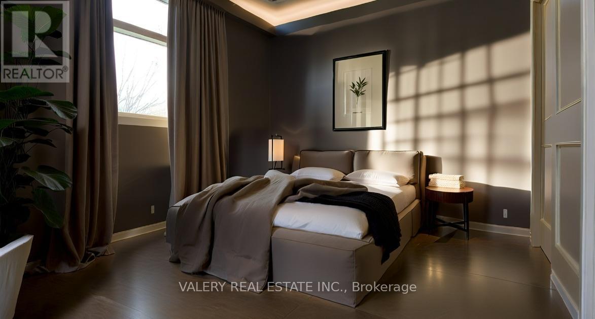 A bedroom with a large bed and a small table.