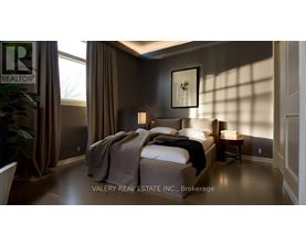 A bedroom with a large bed and a small table.