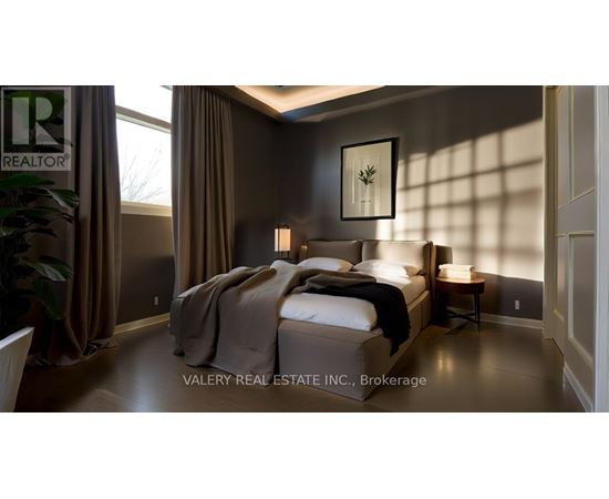 A bedroom with a large bed and a small table.