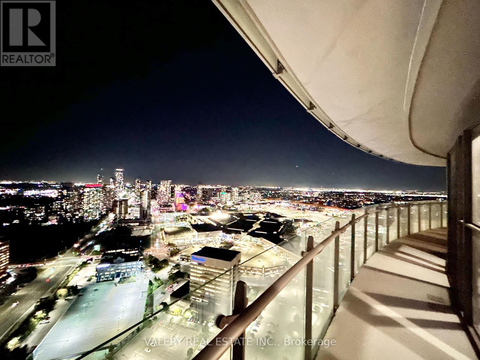 A night view of a cityscape from a high-rise building.