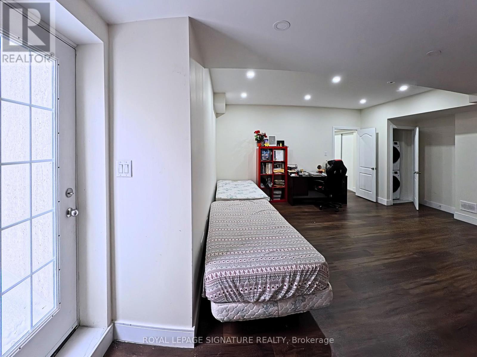 A room with a bed and a window.