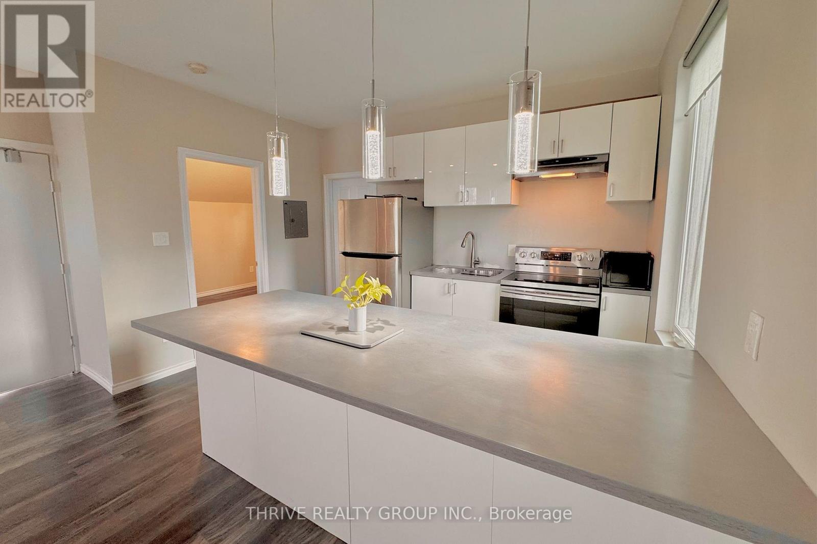 A kitchen with a large island in the middle.