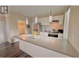 A kitchen with a large island in the middle.