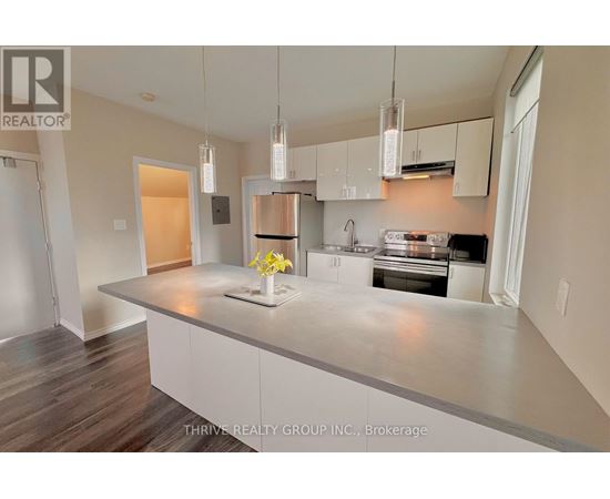 A kitchen with a large island in the middle.
