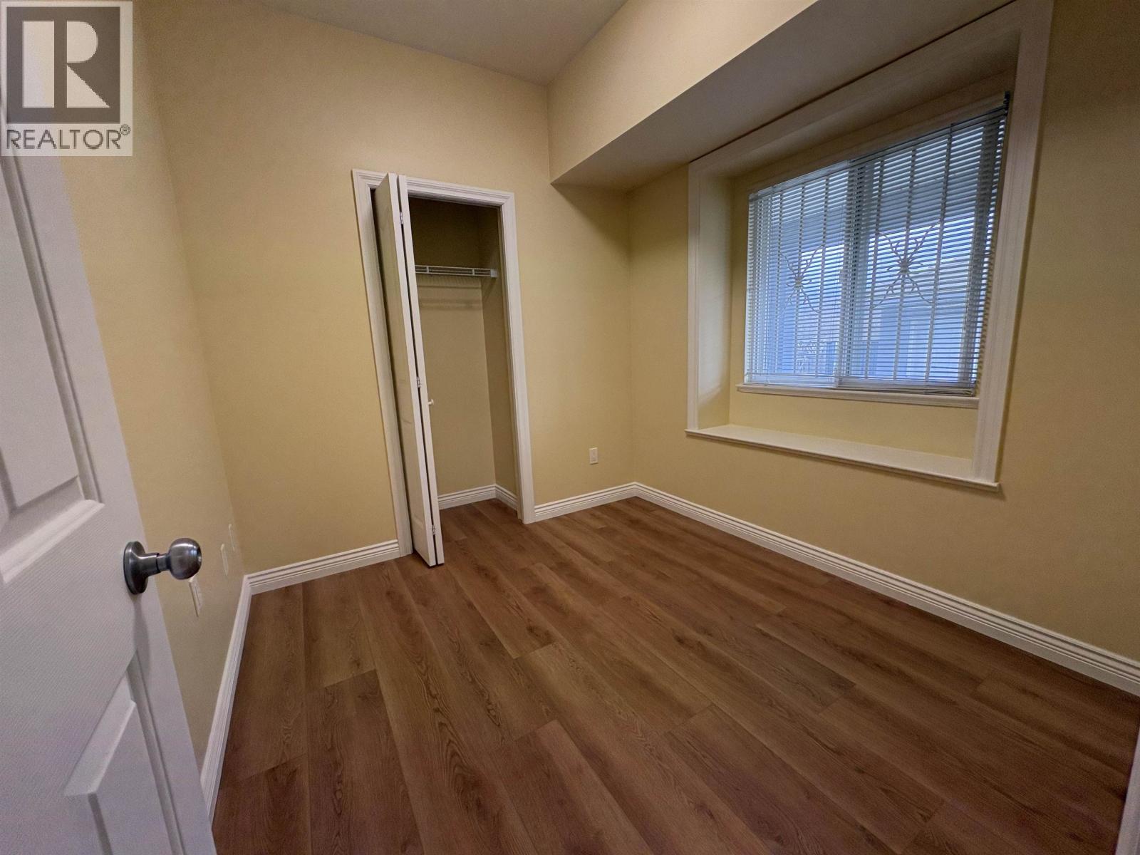 A room with a door and a window.