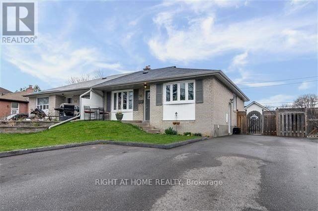 A house with a driveway in front of it.