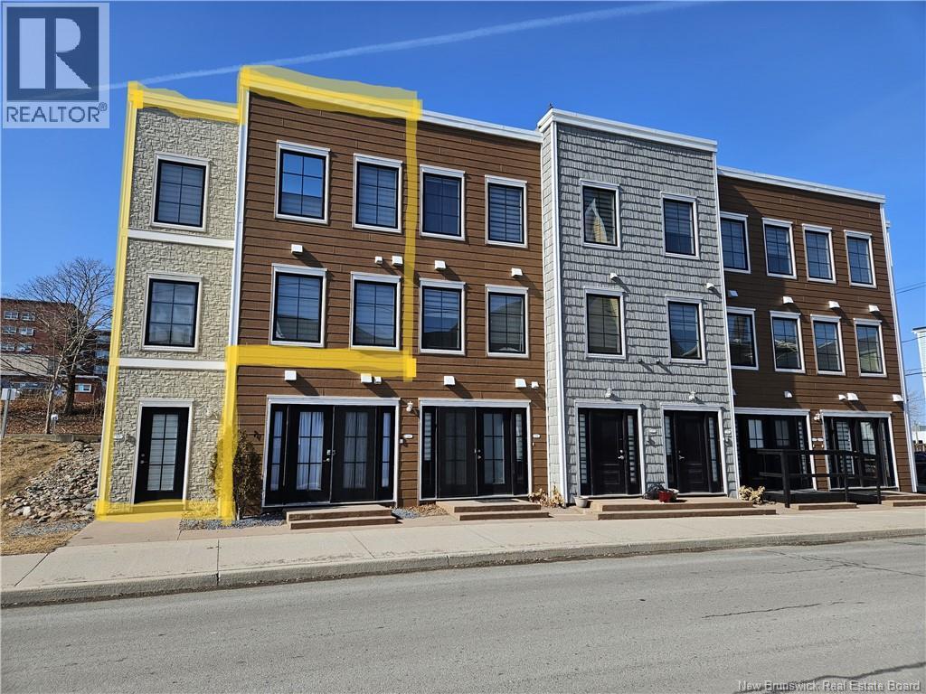 A building with a yellow stripe on the side.