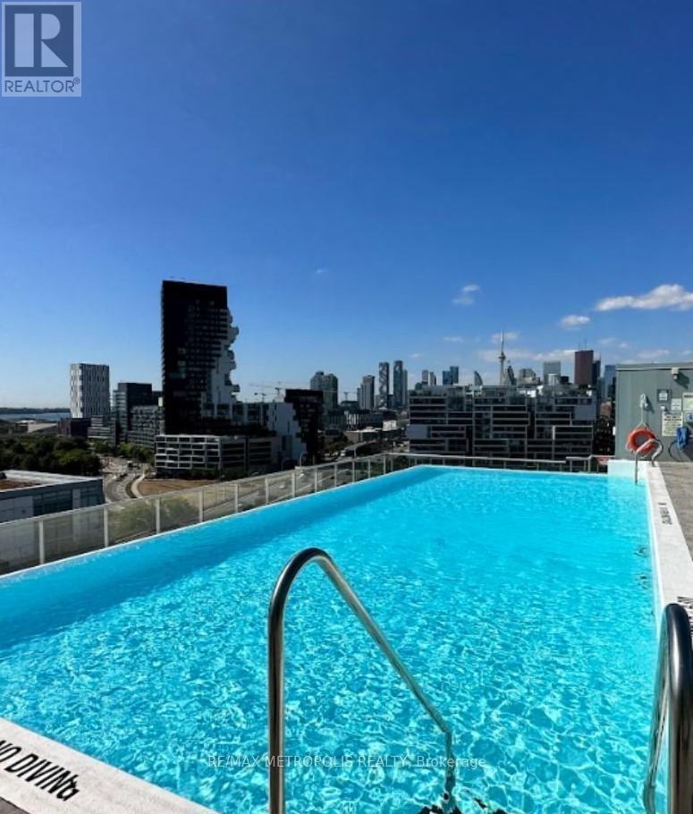 A swimming pool with a view of the city skyline.
