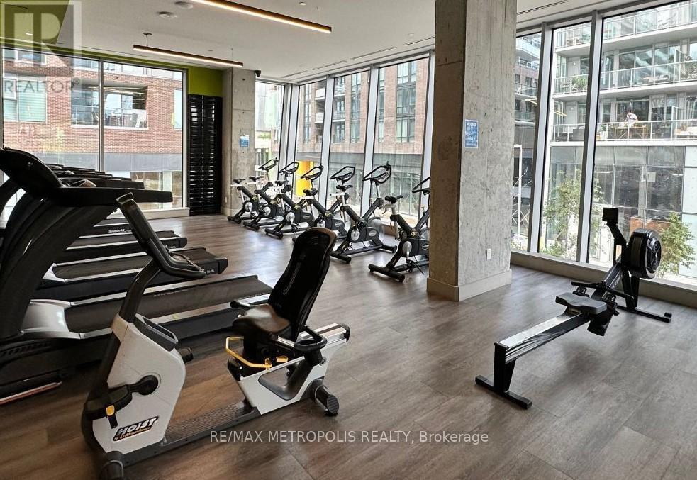 A gym with treadmills and exercise bikes.