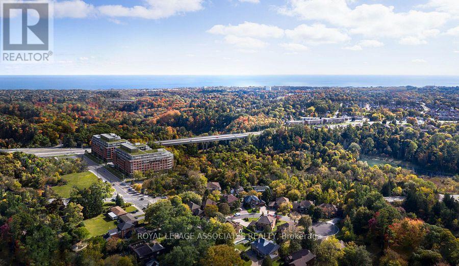 An aerial view of a residential area with a large building in the center.