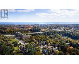 An aerial view of a residential area with a large building in the center.
