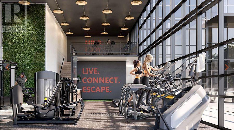 A gym with a green wall and a sign that says "Live. Connect. Escape."