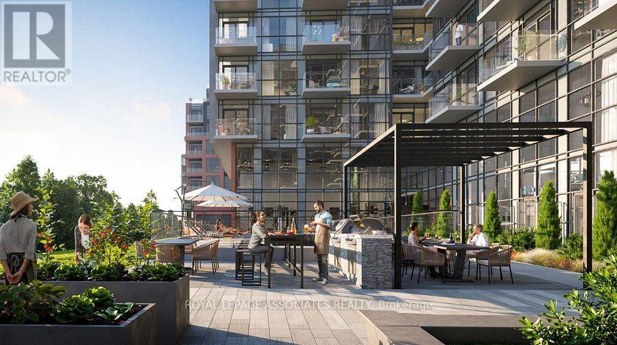 A modern outdoor seating area is surrounded by apartment buildings.