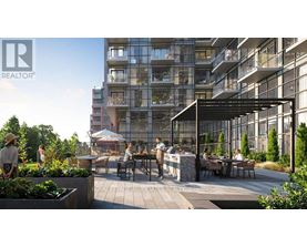 A modern outdoor seating area is surrounded by apartment buildings.