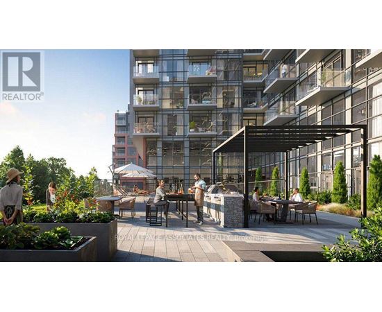 A modern outdoor seating area is surrounded by apartment buildings.
