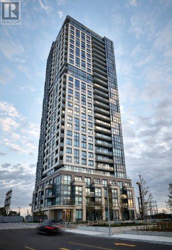 A tall residential building with many windows is shown.