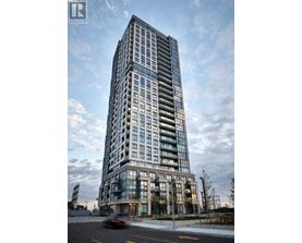 A tall residential building with many windows is shown.