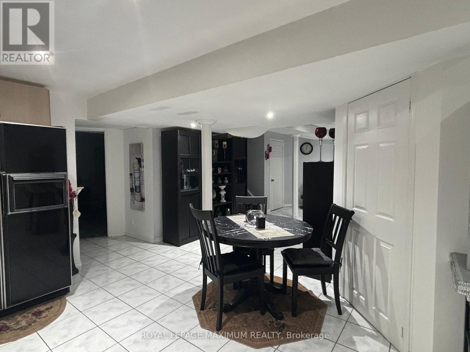 A dining room with a table set for two.