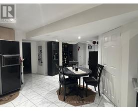 A dining room with a table set for two.