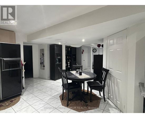 A dining room with a table set for two.