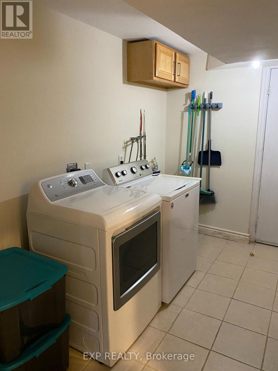 A white kitchen with a dishwasher and oven.
