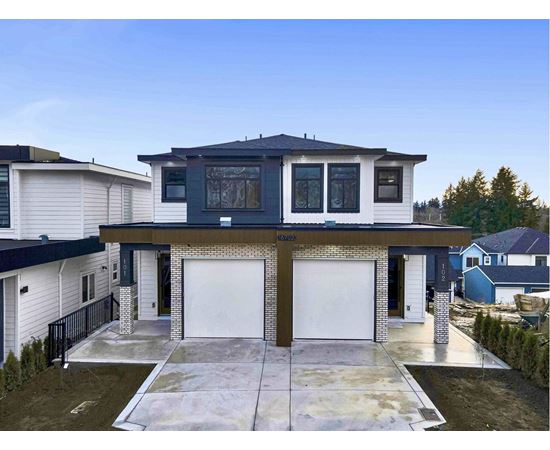 A modern two-story house with a garage.