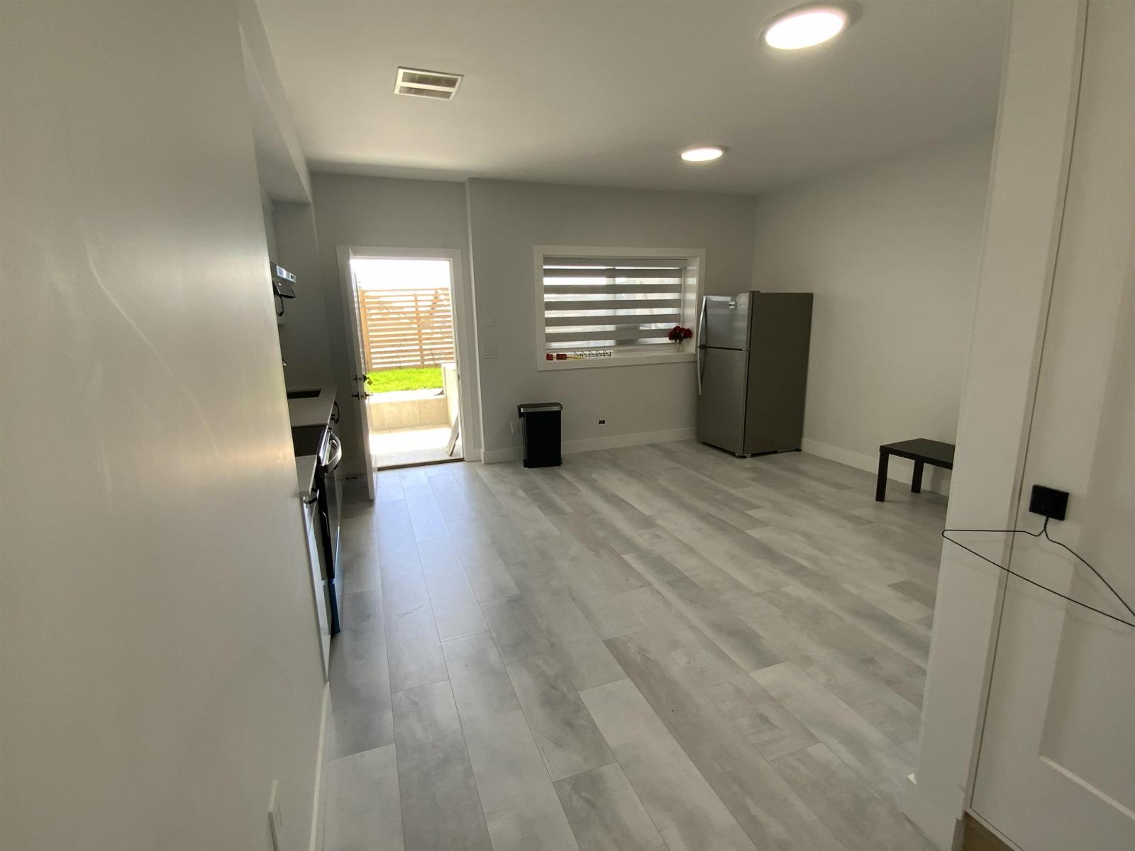 A room with a grey floor and white walls.