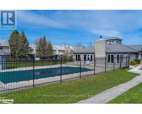 A large house with a pool in the backyard.
