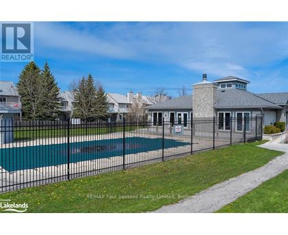 A large house with a pool in the backyard.