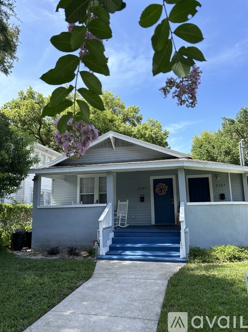 A house with a blue door and a porch.