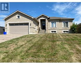 A house with a garage and a driveway is for sale.