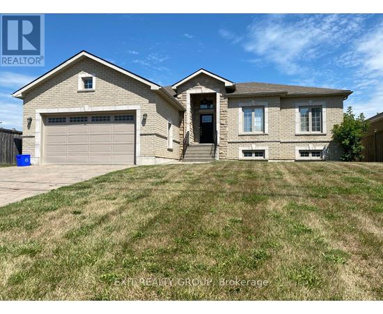 A house with a garage and a driveway is for sale.